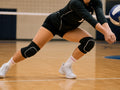 Athlete wearing knee pads for volleyball diving on court
